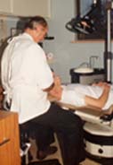 Dentist using a Bambach Saddle Seat