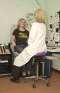Optometrist using a Salli Saddle Chair
