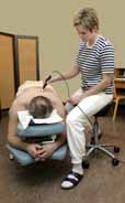 Physical Therapist using a Salli Saddle Stool